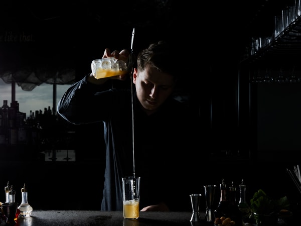 a bartender mixing drinks at Lui Bar, Melbourne CBD