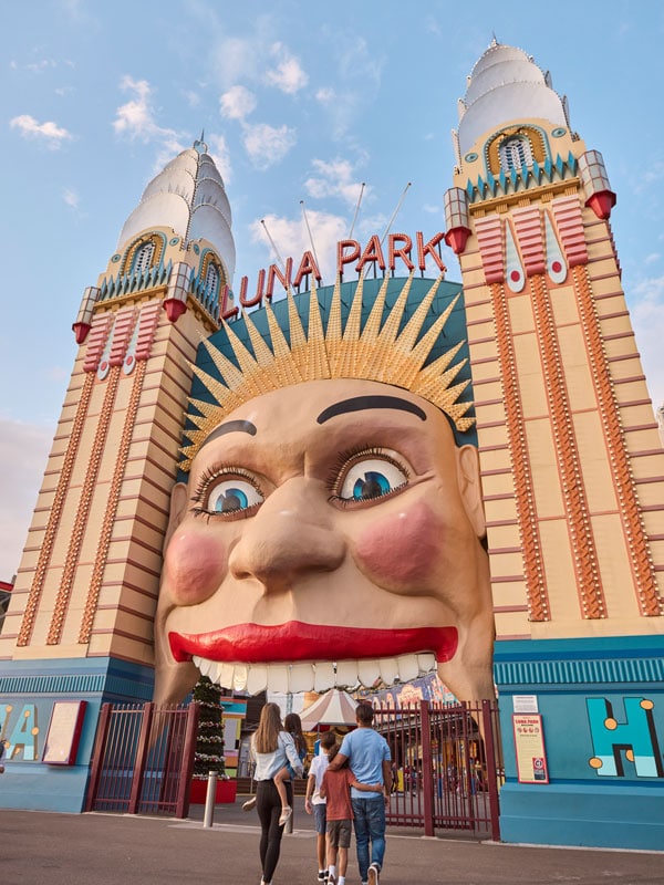 a family walking into Luna Park Sydney, Milsons Point