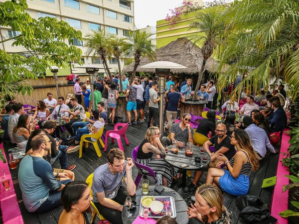 the Palmz Rooftop Bar at Melbourne CBD filled with guests