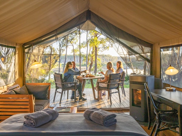 guests enjoying the Tanja Lagoon Camp luxury accommodation with Navigate Expeditions