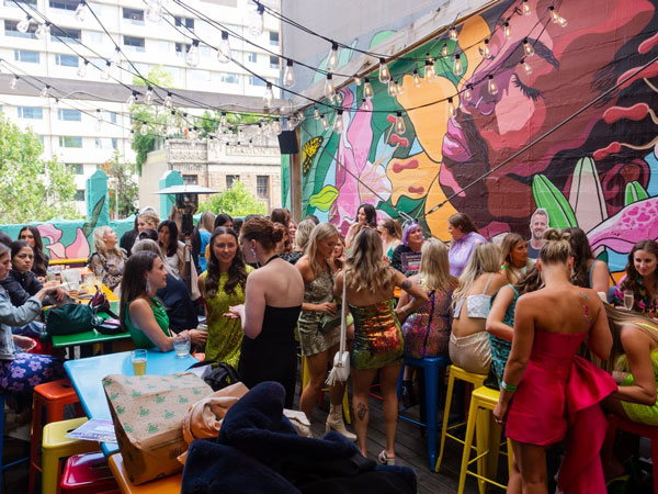 the crowded rooftop bar at Heroes, Melbourne