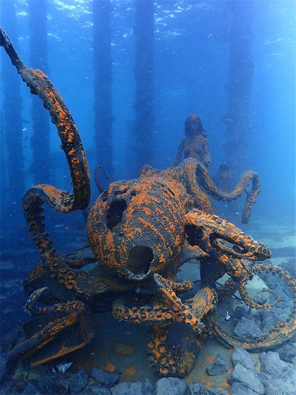 A mermaid and octopus sculpture by Daniel Fisher.