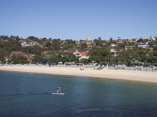 a stand-up paddleboarder at Balmoral Beach, Mosman