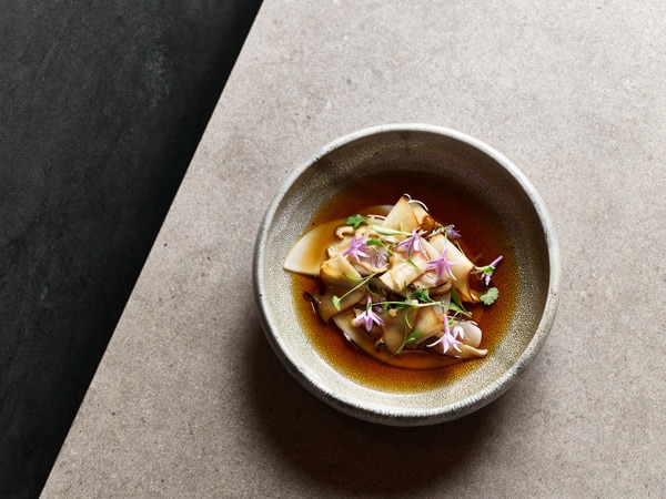 a table-top view of food at Aria