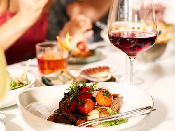a close-up shot of food and wine at Bar Lune