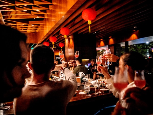 people raising their wine glasses at Grain Bar