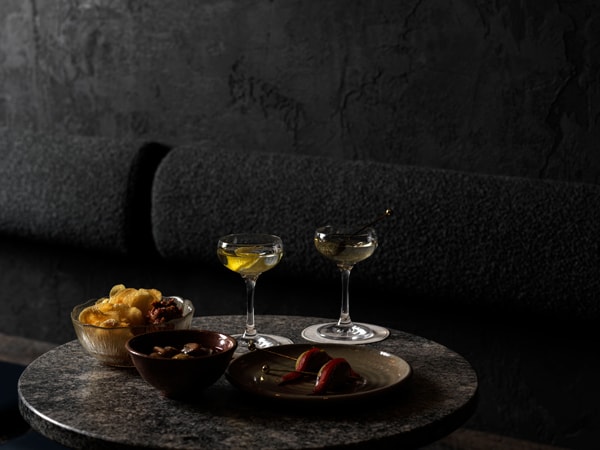 drinks at the dimly lit bar at arkhé