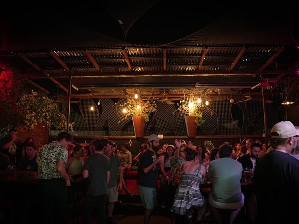 people enjoying inside the dimly lit bar at Epilogue Lounge, Alice Springs