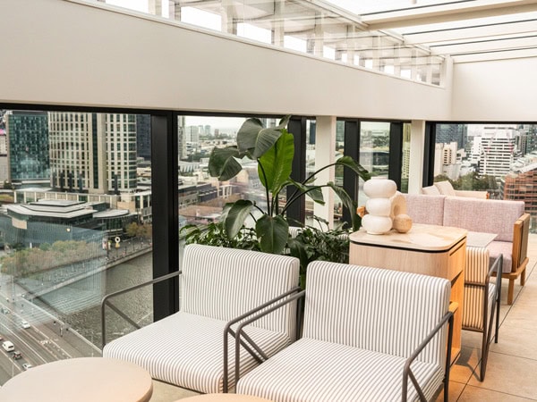 the light-filled space with empty seats at Fleet Rooftop Bar