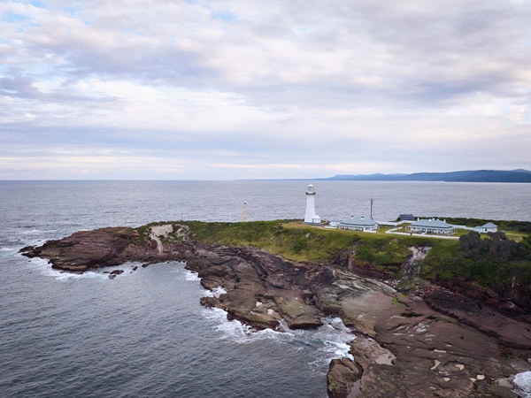 an aerial view of the Green Cape lookout and lighthouse