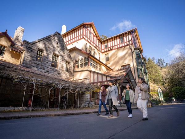 friends walking outside Caves House, Jenolan Caves