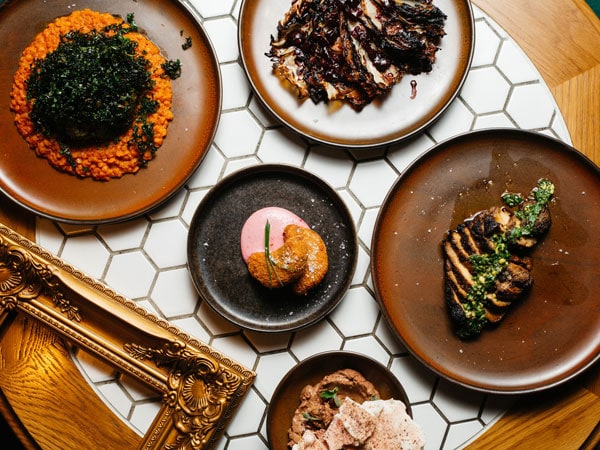 a table-top view of a five-course menu at Lona Misa