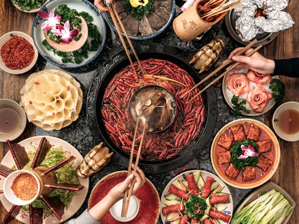 a table-top view of cooking hot pot at Panda Hot Pot