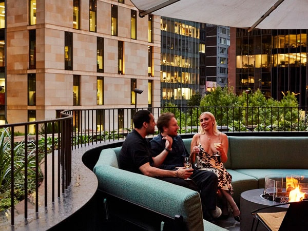 friends sitting and enjoying drinks at The Panorama Bar at The International, Sydney