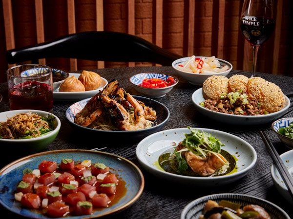 an array of dishes on the table at Spice Temple, Melbourne
