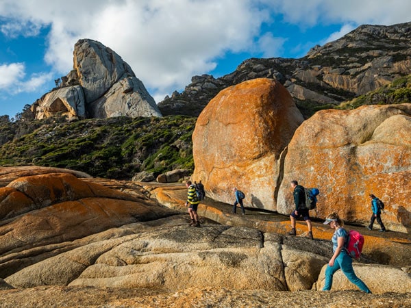 Walkers scale dramatic rocks on Flinders Island