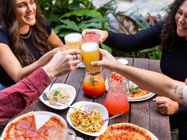 friends enjoying food and drinks at Vapiano
