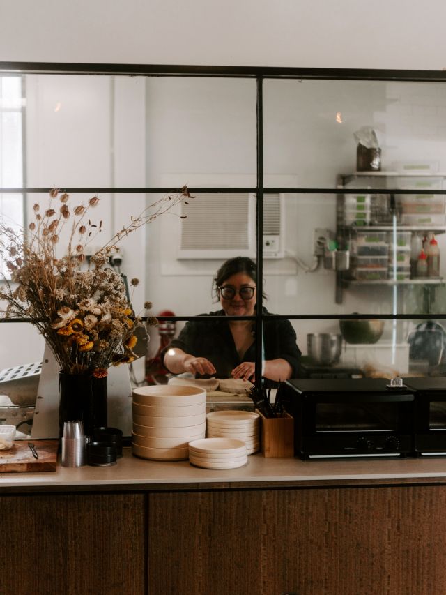 a woman preparing coffee orders at the counter, Core Roasters in Melbourne