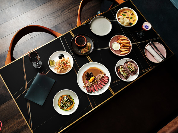 a table-top view of food plates at Rufio, St Kilda restaurants