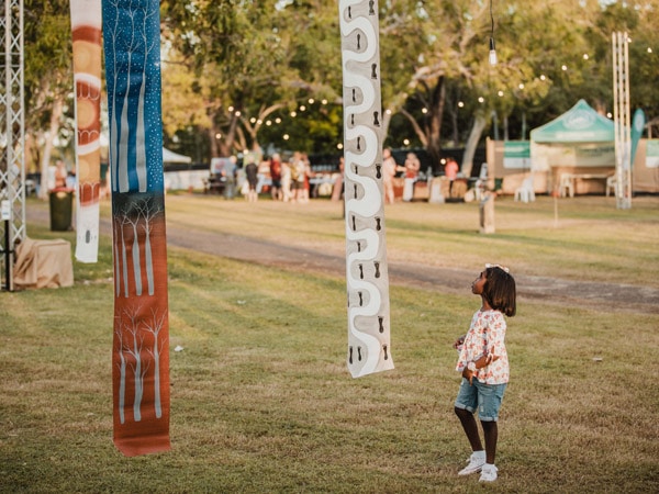 a child exploring at Art in the Park at the Ord Valley Muster