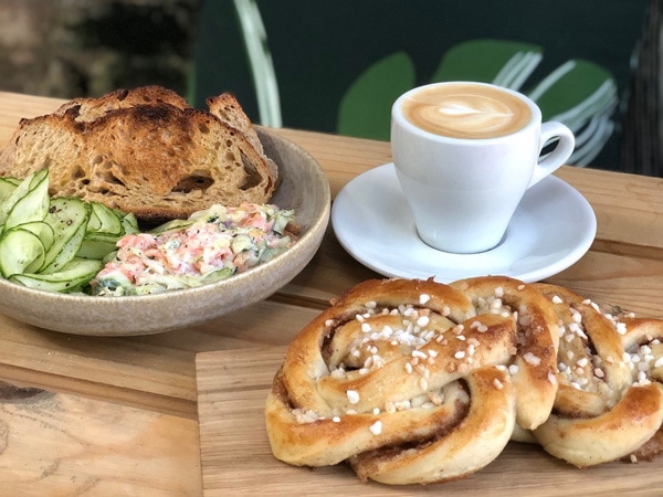 a spread of breakfast menu with coffee on the table at Funkis Köket café, Paddington