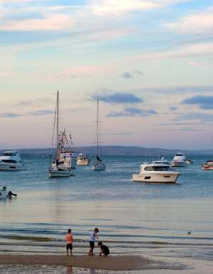 Boats and children on beach at Port Lincoln