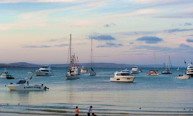 Boats and children on beach at Port Lincoln