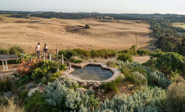 a couple heading towards a thermal pool at Peninsula Hot Springs