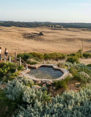 a couple heading towards a thermal pool at Peninsula Hot Springs