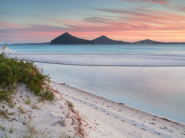 Windy sunset from Winda Woppa Reserve, overlooking Wind Woppa Lagoon and views to Mt Tomaree, Stephens Peak and Shoal Bay.