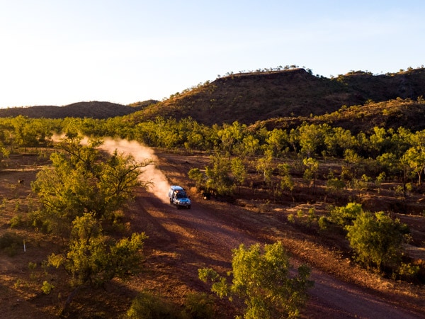 a vehicle driving along the Savannah Way toward Boodjamulla National Park