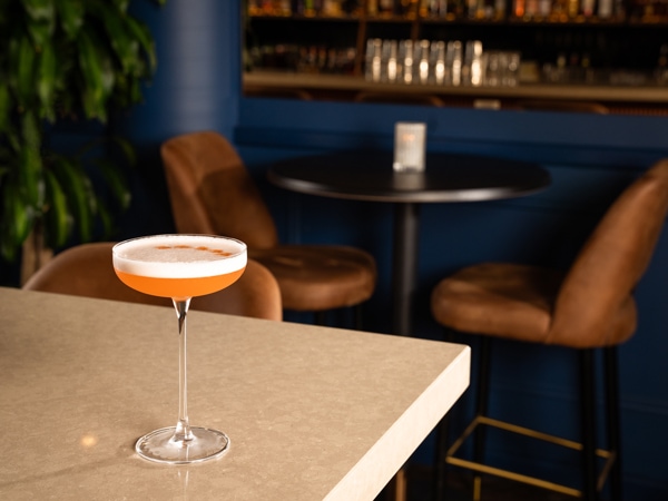 a cocktail drink on the table at WAT Den