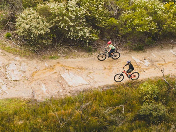 Women cycling aroud Manly Dam