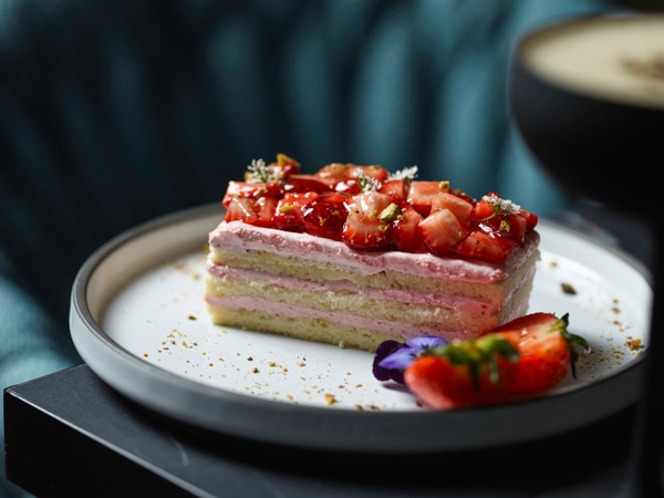 a close-up shot of a dessert on a plate at Blaq Restaurant in Kyah Boutique Hotel