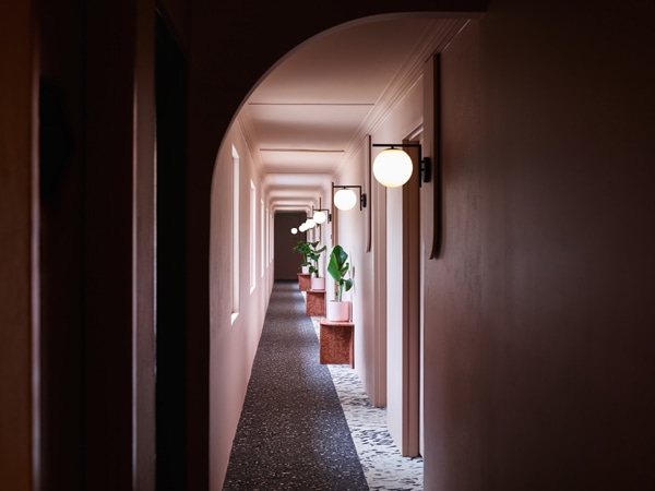 Pastel pink hallways at Kyah Boutique Hotel