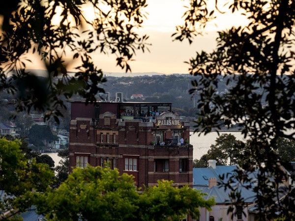 the view of the Hotel Palisade's rooftop bar from Observatory Hill, Millers Point