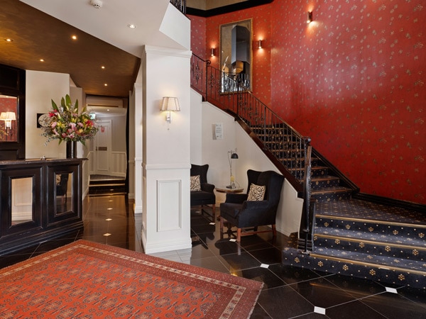 the lobby and staircase at Echoes Blue Mountains Boutique Hotel