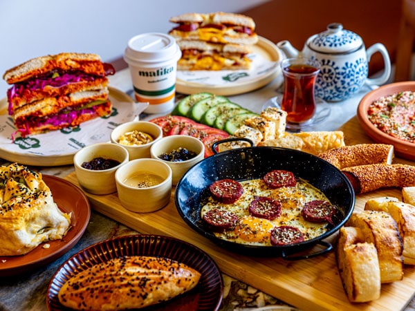 an array of food on the table at Malika Bakehouse