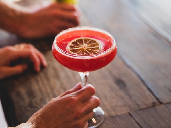 a hand holding a cocktail at Manly Wharf Hotel