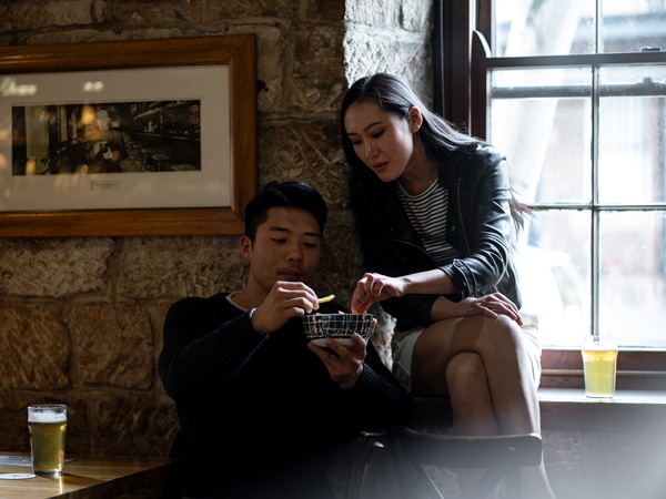 a couple enjoying food and drink at Lord Nelson Brewery, The Rocks