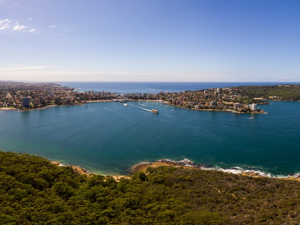 scenic coastal aerial view across Sydney Harbour from the Spit Bridge to Manly Walk