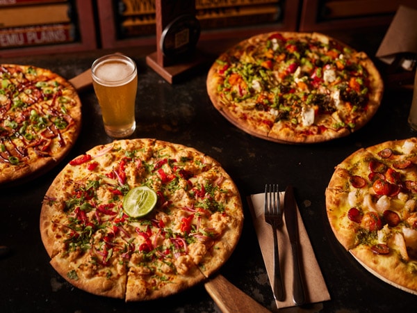 pizza and beer on the table at The Australian Heritage Hotel, The Rocks
