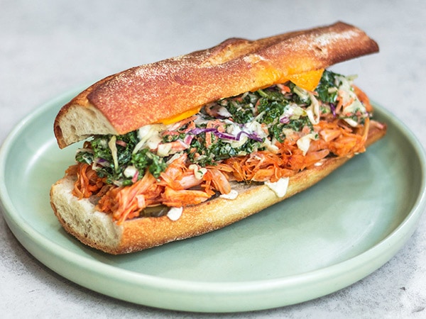 a carrot banh mi sandwich on a plate