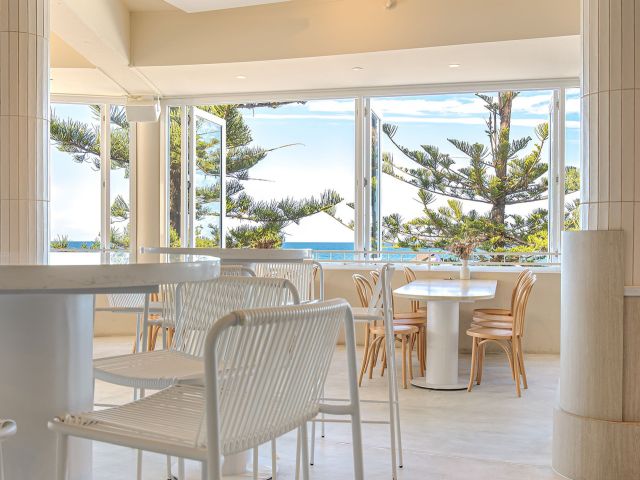 inside Dune by Pavilion with wide windows overlooking the beach