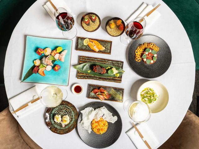 a table-top view of food at Fish House Steak & Grill, Mooloolaba