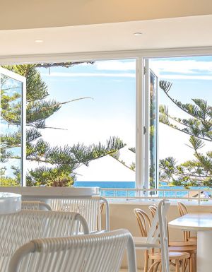 inside Dune by Pavilion with wide windows overlooking the beach