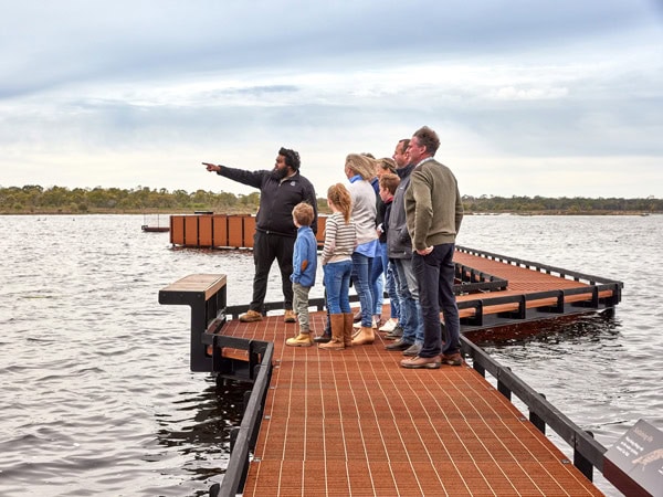 a group of people taking a cultural tour at Budj Bim Cultural Landscape