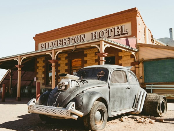 a vintage car in front of Silverton Hotel