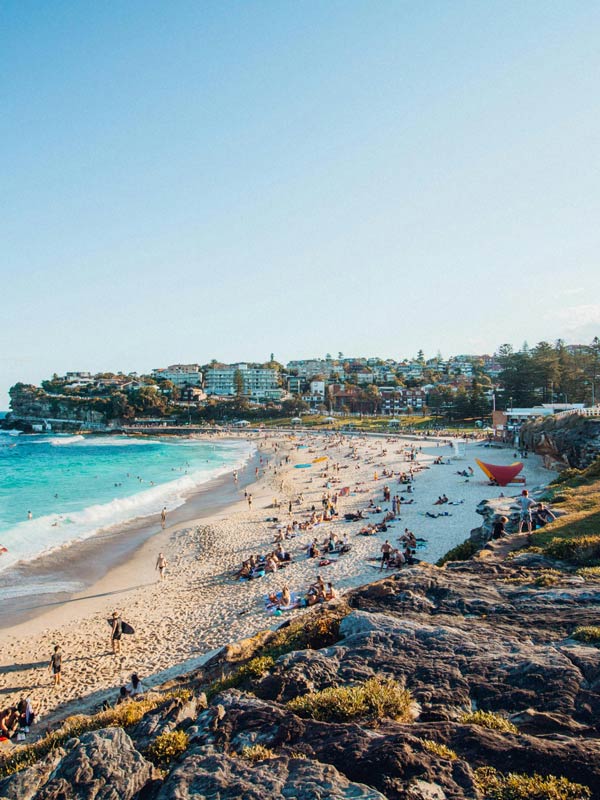 People on the sand and the water at Bronte Beach