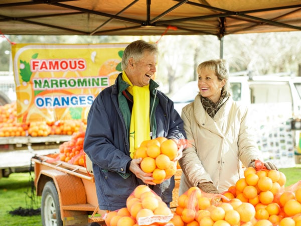 Locals farmers with their famous Narromine oranges at the Dubbo Farmers Market.